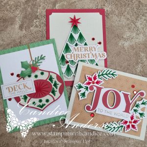 Three crafted Christmas cards featuring traditional holiday designs, including an ornament with 'Deck the Halls,' a card stating 'Merry Christmas,' and one proclaiming 'Joy to the World,' adorned with festive decorations in red and green.