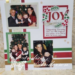 A festive scrapbook layout celebrating Christmas with photos of a family, decorated with a 'JOY TO THE WORLD' title and seasonal embellishments in red, green, and gold.