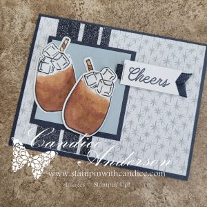 A handmade card featuring two drink images with ice, set against a patterned background, and the word 'Cheers' in stylish typography.