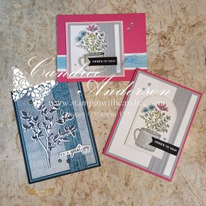 A display of three unique greeting cards featuring floral designs, each in different color schemes and layouts. The cards showcase a mix of elements such as stamped images, embellishments, and various backgrounds.