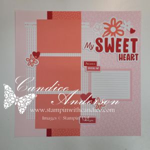 A scrapbook layout featuring a pink background with decorative elements, including the phrase 'My SWEET HEART,' flowers, and hearts. It includes space for two photos and journaling or notes.