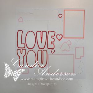 Crafting layout featuring the words 'LOVE YOU' in bold letters, accompanied by heart shapes and blank photo frames.