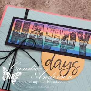 A colorful handmade card featuring the word 'HAPPY' in bold lettering with a gradient background of sunset colors and palm trees. The word 'days' is written in a cursive style on a circular yellow embellishment, with black twine tied around the card.